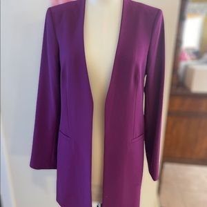 Calvin Klein ladies mid length jacket. Size US 8. Never used.